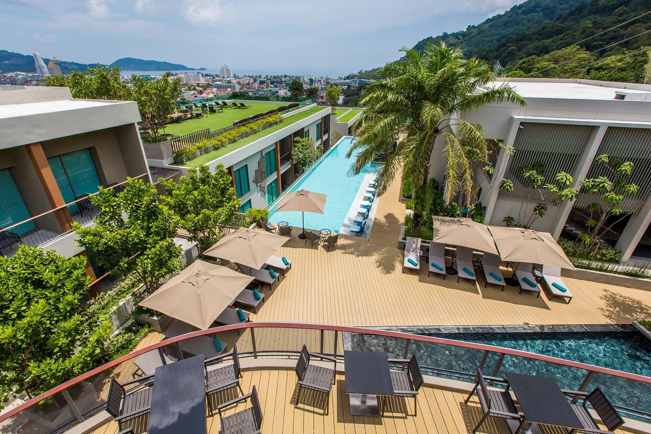 Fusion Suites Phuket Patong Eksteriør bilde The swimming pool at the hotel