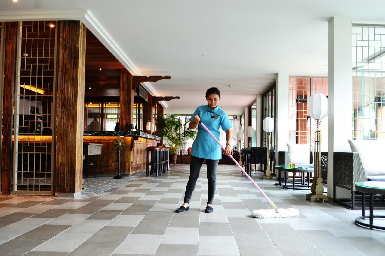 Fusion Suites Phuket Patong Eksteriør bilde A hotel housekeeper mopping the floor
